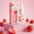 SuperAroma Erdbeere – Fläschchen und Verpackung mit frischen Erdbeeren auf rosa Hintergrund